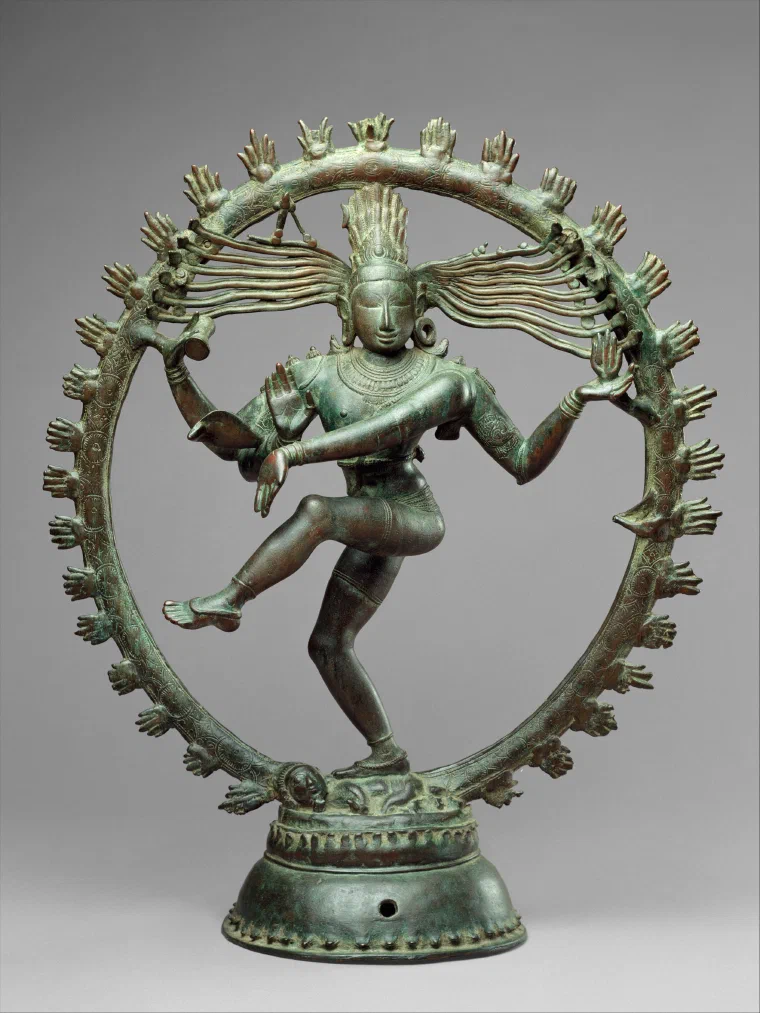 Bronze Shiva Nataraja dancing within a ring of flames above a small crouching figure