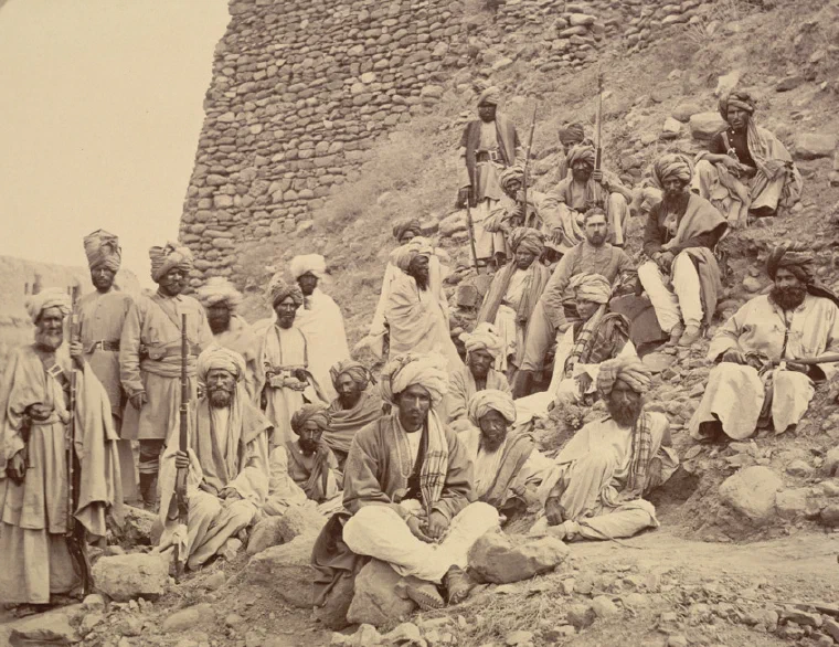John Burke photograph from 1878 of Khyber chiefs seated and standing with a British officer