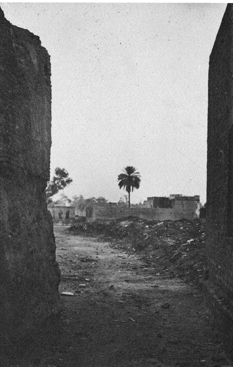 Photograph from 1919 of the narrow walled entrance passage leading into the Jallianwala Bagh enclosure at Amritsar