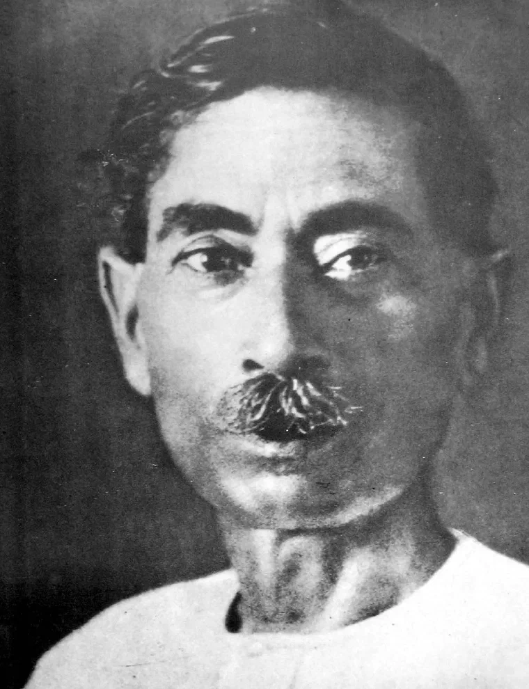 Black-and-white portrait of the Hindi and Urdu writer Premchand with short hair and a mustache