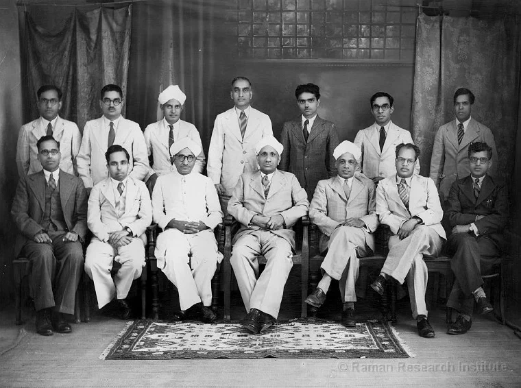 Black-and-white group portrait of C. V. Raman seated with fourteen scientists from the Indian Association for the Cultivation of Science around 1929