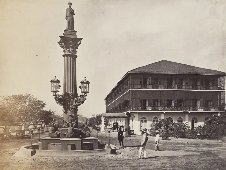 Nineteenth-century photograph of the ornate Khada Parsi memorial column beside the Byculla Hotel in Bombay