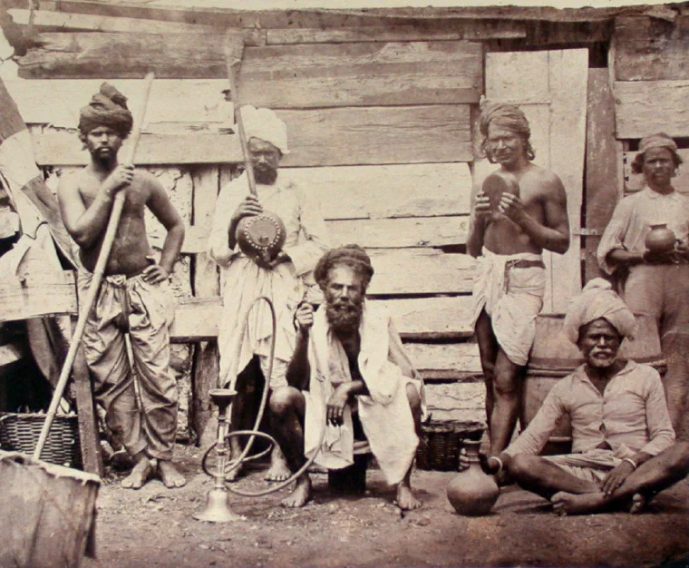 Group of Indian indentured labourers photographed on a sugar estate in Mauritius in 1870