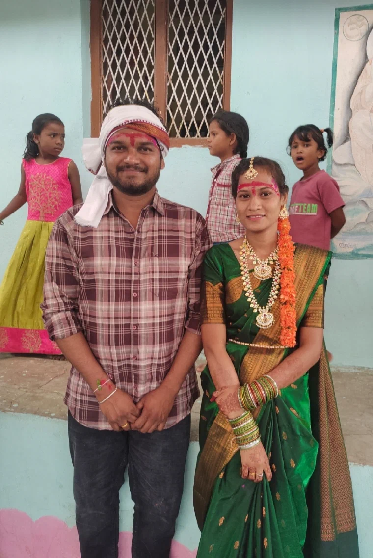 Members of the Raj Gond community in Adilabad wearing contemporary and festive clothing outside a building