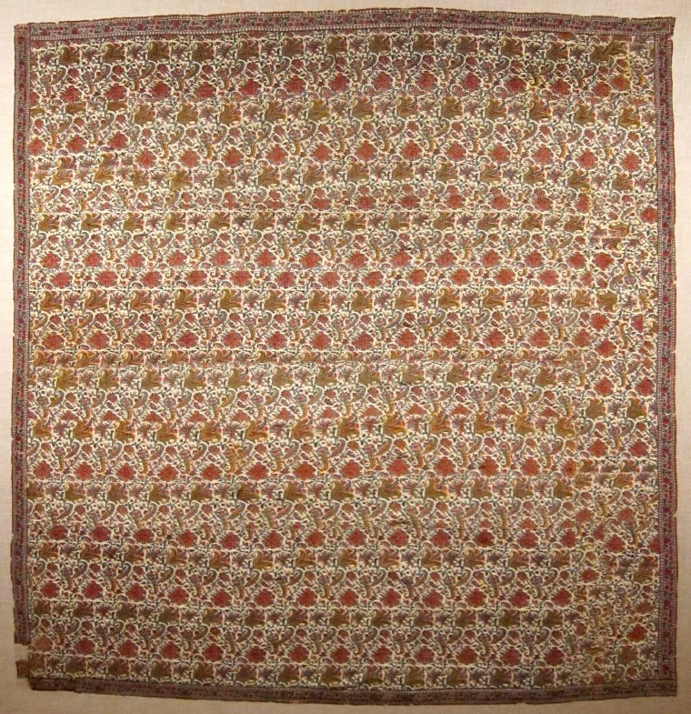 Mid-nineteenth-century Kashmir shawl densely woven with curved botanical cone motifs in red, blue and gold